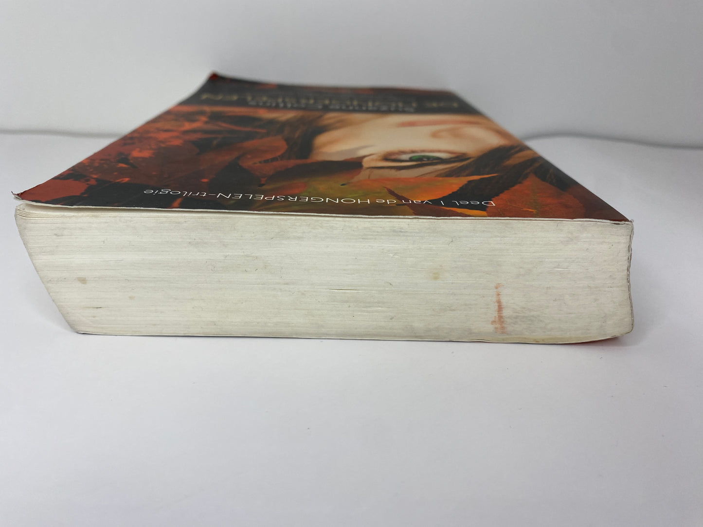 De Hongerspelen van Suzanne Collins boek 1 in De Hongerspelen trilogie, ISBN: 9789047515975 bovenkant