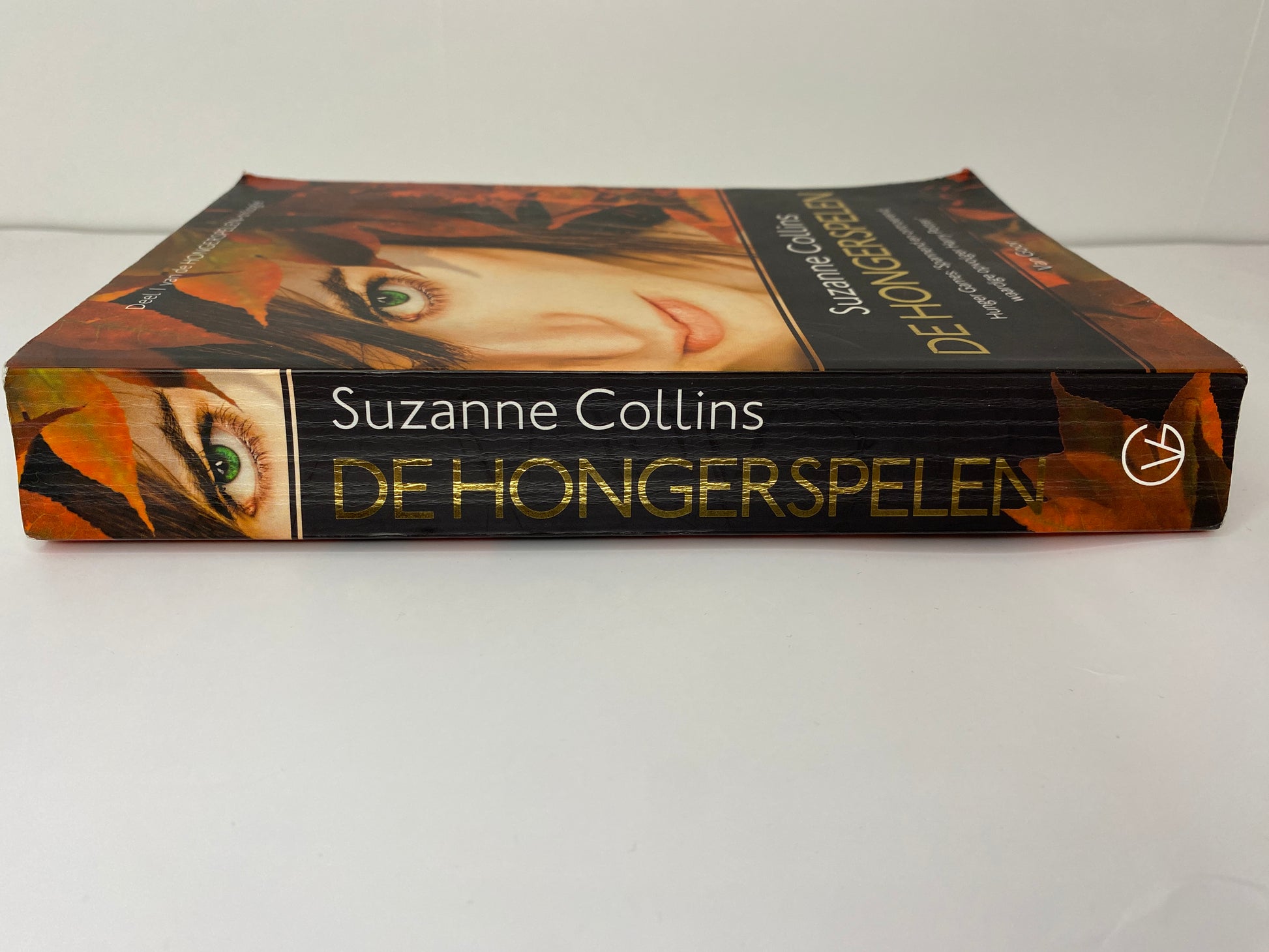 De Hongerspelen van Suzanne Collins boek 1 in De Hongerspelen trilogie, ISBN: 9789047515975, rug